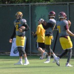ASU quarterback Mike Bercovici warms up with fellow QBs Brady White (right) and Manny Wilkins (center) during the team’s practice Monday in Tempe. (Cronkite News photo by Bill Slane)