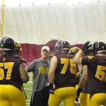 “It didn’t surprise me just because of how hard those guys work,” said ASU assistant head coach and offensive line coach Chris Thomsen (center, in white hat) of two of his players being named to preseason national award watch lists. “To me, when you combine talent with great work ethic, great motivation, great focus, if you do that, those things will eventually come to you.”