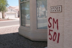 Paint marks an Ahwatukee home slated for demolition to make way for the planned South Mountain Freeway.