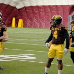 ASU RBs Demario Richard (4), Kalen Ballage (9) and Jacom Brimhall (35) run through ball protection drills during practice inside the Verde Dickey Dome in Tempe on Tuesday. (Cronkite News photo by Bill Slane)