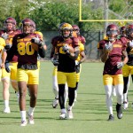 Sun Devils, including wide receiver D.J. Foster (center), stretch before practice in Tempe on September 8, 2015. (Cronkite News photo by Bill Slane)