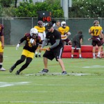 ASU running back Kalen Ballage runs through a ball protection drill in his return to practice on Tuesday. Head coach Todd Graham says he will play on Saturday. (Cronkite News photo by Bill Slane)