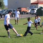 Suns General Manager Ryan McDonough plays soccer with students at Loma Linda Elementary. (Cronkite News photo by Kevin Jimenez)