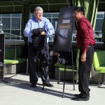 Win Holden, publisher of Arizona Highways, and Robert Miguel, councilmember of the Ak-Chin Indian Community, unveil the official logo of the Championship Campus that will be in downtown Phoenix from Jan. 8-10 for the College Football Playoff.