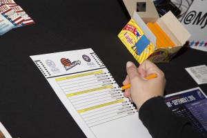 A student attending a recent Phoenix Mercury game fills out a ballot asking for choices on favorite Mercury player and more.