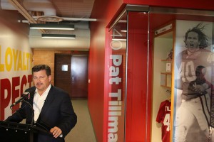 Cardinals president Michael Bidwill talks about the team’s training facility renovation while standing next to the Pat Tillman honorary locker.