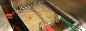 French fries cook in a deep fryer at French Fry Heaven’s Tempe location. (Photo by Jason Axelrod/Cronkite News)