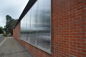 Six panels on a south-facing wall of this warehouse make up a solar thermal system that provides heat without natural gas. (Photo by Samantha Witherwax/Cronkite News)