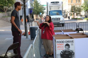 Volunteers with St. Mary’s Food Bank tend food-donation boxes at a drive held Sept. 17, 2015, in downtown Phoenix.