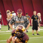 ASU offensive coordinator Mike Norvell watches the running backs in a ball protection drill inside the Verde Dickey Dome on Oct. 6, 2015 in Tempe. (Cronkite News photo by Bill Slane)