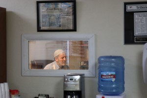 Imam Ahmad Shqeirat holds a meeting in his office in Tempe.