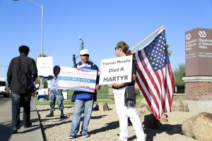 Ricky Barnes, center, a 54-year-old medically disabled and retired U.S. Air Force veteran founded EnvincibleVets and organized a rally Monday, Nov. 9, 2015, to protest slow and substandard care from the Phoenix VA Medical Center. He is joined by Alison Culver. (Photo by  April Morganroth/Cronkite News)