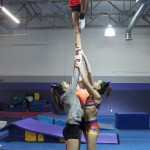 Cheerleaders from AZ All-Stars Tumbling and Cheer perform a routine at their practice facility, Monday, November 30, 2015, in Tempe. (Photo by Cody Fincher/Cronkite News)