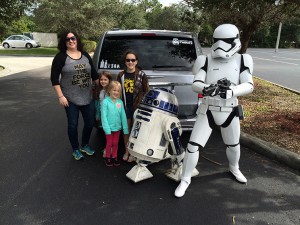 Katrina Beckham and her daughters pose next to their new minivan purchased from Carvana. (Photo courtesy of Beckham family)