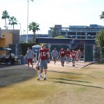Alabama football players jog onto the field at the Arizona State football practice facility before their practice on Jan. 9 in Tempe. (Photo by Bill Slane/Cronkite News)