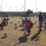Clemson football players stretch before their practice at Scottsdale Community College on Jan. 9. (Photo by Bill Slane/Cronkite News)