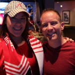 Kyndall Holstead (left), and Brandon Cheshire (right) enjoy watching the Crimson Tide take on Clemson at the Half Moon Windy City Grill in Phoenix. (Photo Credit: Torrence Dunham/Cronkite News)