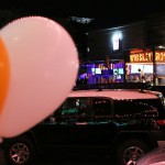 The orange and white ballons fly for Clemson at El Hefe but across the street the colors of the Crimson Tide fly high in this Battle on The Block. (Photo Credit: Torrence Dunham/Cronkite News)