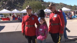 Two members from the Royal Mounted Canadian Police, also called Mounties, pose at the 64th Annual Great Canadian Picnic. (Photo by Elena Mendoza/Cronkite News)