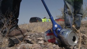 Volunteers for the Adopt a Highway program pick up a beer can along an Arizona highway. (Photo courtesy of Arizona Department of Transportation)