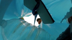 A volunteer for the Adopt a Highway program places litter in a garbage bag. (Photo courtesy of Arizona Department of Transportation)