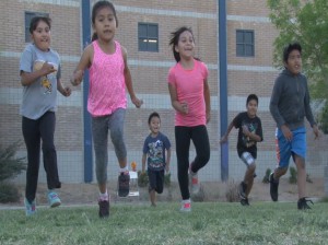 Children participating in the Athletes For Life program warm-up at the South Mountain Community Center. (Photo by Elena Mendoza/Cronkite News)