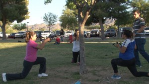 Adults in Athletes For Life, a program to promote healthy behaviors in parents and their children, learn new exercises at the South Mountain Community Center. (Photo by Elena Mendoza/Cronkite News)