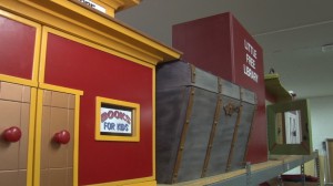 A few Little Free Libraries were displayed at the Southwest Human Development center. These were donated and were waiting to be placed in communites. (Photo by Lauren Michaels/Cronkite News)