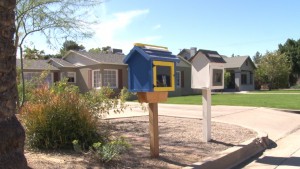 Two Little Free Libraries are displayed in front of homes in Phoenix. (Photo by Lauren Michaels/Cronkite News)