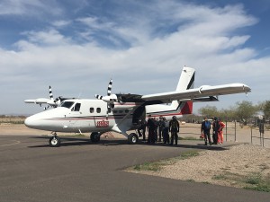 Skydivers lined up to load one of Skydive Arizona’s planes before take off. (Photo by Chloe Nordquist/Cronkite News)