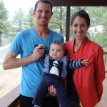 Ben and Stephanie Bruce, pictured with their second son, Hudson, are professional runners part of HOKA Northern Arizona Elite running team. (Photo by Kylee Sam/Cronkite News)