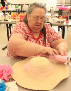 Betty Molina hard at work creating a hat for the Kentucky Derby at Cahill Senior Center, Wednesday, April 20, 2016, in Tempe, Ariz.(JMC Photo/Kendall Bartley)