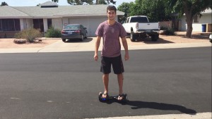 Jordan Masters, an Arizona State University student, sells hoverboards for VBoards. He said business has slowed dramatically. (Photo by Zac Pacleb/Cronkite News)