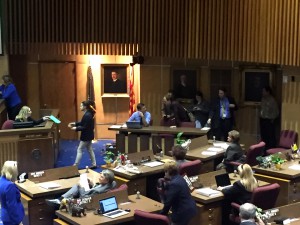 Legislative reporters stood as a larger-than-usual group behind their media tables in Thursday’s state Senate session in Phoenix, on April 7, 2016. (Photo by Miguel Otárola/Cronkite News)