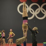 Olympic gold medalist Amanda Borden-Cochran instructs gymnasts at her Chandler gym. (Photo by Nicole Vitale/Cronkite News)