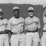 Jackie Robinson (second from left) stands with teammates on the Pasadena Junior College baseball team. Robinson was a standout athlete at PJC and UCLA before breaking MLB's color barrier. (Photo courtesy of Pasadena City College)