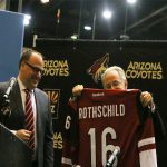 Coyotes President and CEO Anthony LeBlanc (left) poses with Tucson mayor Jonathan Rothschild and his customized Coyotes jersey. (Photo by Joseph Steen/Cronkite News)