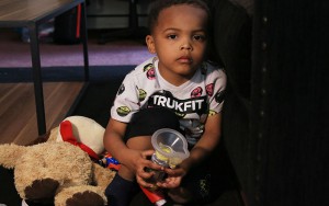 Zaviyon Scott, 4, holds one of his inhalers of which he uses 6 times per day. (Photo by Alejandra Armstrong/Cronkite News).