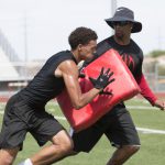 Phoenix College wide receiver coach Kerry Taylor works at Camp 29, a summer football camp for local high school players. Taylor is also the head coach at Salt River High School. (Photo by John Alvarado/Cronkite News)