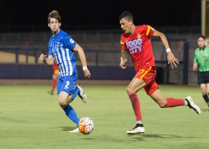 Arizona United forward Tyler Blackwood has found his form since Cortez’s return as he dribbles past an Orange County Blues FC defender during their game on June 11. (Photo courtesy of Michael Rincon/ Arizona United)