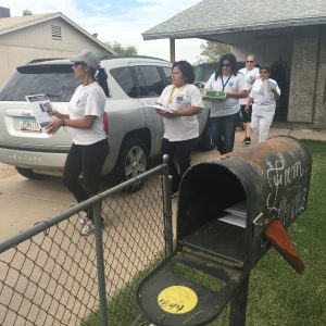 The women of the Maryvale neighborhood block watches go door-to-door passing out flyers and recruiting potential members. (Photo by Selena Makrides/Cronkite News)
