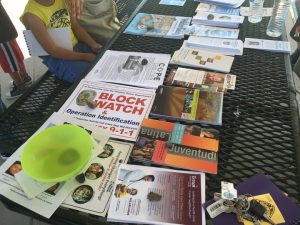 The Peralta Lions Block Watch handed out materials to attendees explaining how to report suspicious activity. (Selena Makrides/Cronkite News)