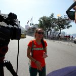 Ryan Curry interviews ASU swimmer Anna Olasz after her 10K open water swimming event at Copacabana Beach. (Photo by Scotty Bara/Cronkite News)