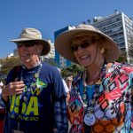 Chuck and Judi Brandt smile at their family while on their way to watch beach volleyball on Copacabana Beach in Rio de Janeiro. (Photo by Courtney Pedroza/Cronkite News)