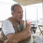 Larry Slater talks about photography at Copacabana Beach in Rio de Janeiro, Brazil on Aug. 12, 2016. (Photo by Jaclyn Chung/Cronkite News)