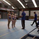 Ashton Locklear, MyKayla Skinner and Ragan Smith get a lecture at the end of practice at the Flamengo Club in Rio de Janeiro, Brazil on Aug. 5, 2016. (Photo by Jaclyn Chung/Cronkite News)