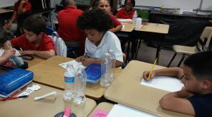 Fourth-grade students at Heritage Elementary School in Glendale work on English class work. (Photo by Jesse Canales/Cronkite News)