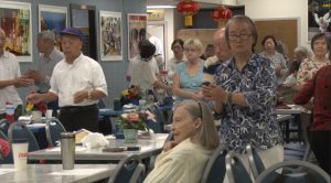 Members of the Chinese Senior Center in Phoenix exercise before eating lunch. (Photo by Katelyn Greno/Cronkite News)