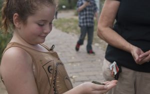 Emily Tucker, 8, traveled with her family from Chandler to spend her birthday with the hummingbirds. (Photo by Kristiana Faddoul/Cronkite News)