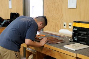 James Choi, a 32-year-old student at Roberto-Venn School of Luthiery, crafts g a guitar. Choi made the jump to luthiery with the support of his wife after being dissatisfied with previous career changes. (Joshua Bowling/Cronkite News)